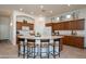 Modern kitchen with curved island and breakfast bar at 17824 W Addie Ln, Surprise, AZ 85374