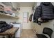 Bright laundry room with washer, dryer, and shelving at 17824 W Addie Ln, Surprise, AZ 85374