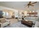 Open living room and kitchen, featuring a neutral color scheme at 17824 W Addie Ln, Surprise, AZ 85374