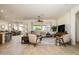 Spacious living room with tile floors and views of backyard at 17824 W Addie Ln, Surprise, AZ 85374