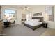 Spacious main bedroom with large bed and window views at 17824 W Addie Ln, Surprise, AZ 85374