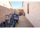 Side yard with bikes, scooter, and gate access at 17824 W Addie Ln, Surprise, AZ 85374