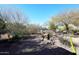 Landscaped backyard with desert plants and gravel at 18658 E Mazatzal Cir, Rio Verde, AZ 85263