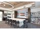 Community room with a large island, comfortable seating, and bookshelves at 18658 E Mazatzal Cir, Rio Verde, AZ 85263