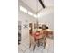 Bright dining room with wood table and chairs, kitchen view at 18658 E Mazatzal Cir, Rio Verde, AZ 85263