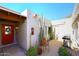 Courtyard entry with red door, cacti, and a built-in grill at 18658 E Mazatzal Cir, Rio Verde, AZ 85263