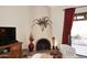 Close-up view of a brick fireplace with a unique design and a rustic feel at 18658 E Mazatzal Cir, Rio Verde, AZ 85263