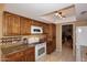 Kitchen with granite countertops and wood cabinets at 18658 E Mazatzal Cir, Rio Verde, AZ 85263
