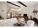 Open concept living area with a fireplace, high ceilings, and dining area at 18658 E Mazatzal Cir, Rio Verde, AZ 85263