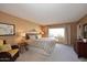 Main bedroom with king-size bed and sitting area at 18658 E Mazatzal Cir, Rio Verde, AZ 85263