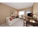 Home office with sofa, desk and large window at 18658 E Mazatzal Cir, Rio Verde, AZ 85263