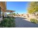 Desert landscape with a covered patio and seating at 20516 N Vermillion Cliffs Dr, Surprise, AZ 85387