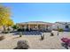 Backyard view of house with desert landscaping at 20516 N Vermillion Cliffs Dr, Surprise, AZ 85387