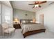 Spacious main bedroom with ample natural light and a large bed at 20516 N Vermillion Cliffs Dr, Surprise, AZ 85387