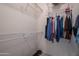 Walk-in closet with wire shelving and hanging rods at 20516 N Vermillion Cliffs Dr, Surprise, AZ 85387