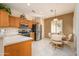 Bright kitchen with stainless steel appliances and wood cabinets at 20516 N Vermillion Cliffs Dr, Surprise, AZ 85387