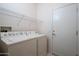 Convenient laundry room with washer and dryer hookups at 20516 N Vermillion Cliffs Dr, Surprise, AZ 85387