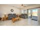Bright living room with tile floors and sliding door access to backyard at 20516 N Vermillion Cliffs Dr, Surprise, AZ 85387