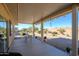 Covered patio with table and chairs, overlooking the desert at 20516 N Vermillion Cliffs Dr, Surprise, AZ 85387