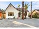 Inviting curb appeal with gravel landscaping and mature palm trees at 2206 N 12Th St, Phoenix, AZ 85006