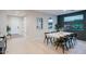 Dining room with a large wooden table and black chairs at 22124 N 34Th St, Phoenix, AZ 85050