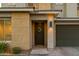 Modern house entrance with a dark-colored door and a wreath at 22124 N 34Th St, Phoenix, AZ 85050