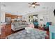 Bright and airy living room with hardwood floors, a comfortable sofa and easy access to the kitchen and backyard at 2347 E Balsam Dr, Chandler, AZ 85249