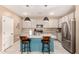 Modern kitchen island with granite countertops and stainless steel appliances at 2476 N Abbey Rd, Casa Grande, AZ 85122