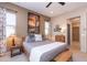 Spacious bedroom with king-size bed, artwork, and access to a bathroom at 40 Almarte Cir, Carefree, AZ 85377