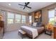 Bright bedroom with large windows, comfortable bed, and stylish decor at 40 Almarte Cir, Carefree, AZ 85377