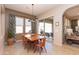 Dining room with glass-top table and access to the back patio at 40 Almarte Cir, Carefree, AZ 85377