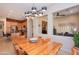 Bright dining room with large glass-top table and modern chandelier at 40 Almarte Cir, Carefree, AZ 85377