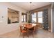 Dining area with mid-century modern table and patio access at 40 Almarte Cir, Carefree, AZ 85377