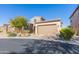 Two-story home with tan siding and attached garage at 40 Almarte Cir, Carefree, AZ 85377
