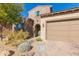 Front view of a two-story home with a tan garage at 40 Almarte Cir, Carefree, AZ 85377