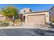 Two story home with tan siding, landscaping and garage at 40 Almarte Cir, Carefree, AZ 85377