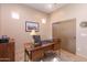 Bright home office with wood desk and window views at 40 Almarte Cir, Carefree, AZ 85377