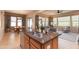 Island kitchen with double sinks and breakfast bar seating at 40 Almarte Cir, Carefree, AZ 85377