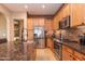Modern kitchen with stainless steel appliances and granite countertops at 40 Almarte Cir, Carefree, AZ 85377