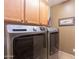 Laundry room with Maytag washer and dryer, and cabinets at 40 Almarte Cir, Carefree, AZ 85377