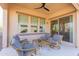 Relaxing patio with seating area, ceiling fan, and access to the backyard at 40 Almarte Cir, Carefree, AZ 85377