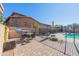 Community patio with grill, table, and pool access at 40 Almarte Cir, Carefree, AZ 85377