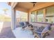 Covered patio with seating area and view of backyard at 40 Almarte Cir, Carefree, AZ 85377