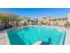 Community pool with plenty of space for relaxation at 40 Almarte Cir, Carefree, AZ 85377