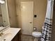 Clean bathroom with single sink vanity, toilet and shower/tub at 4502 N 86Th Pl, Scottsdale, AZ 85251