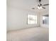 Bright and airy bedroom with large window and ceiling fan at 474 E Sheffield Ave, Gilbert, AZ 85296