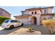 Two-story house with a two-car garage and desert landscaping at 4826 S 26Th Ln, Phoenix, AZ 85041