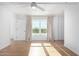 Spacious bedroom with hardwood floors and large window at 535 W Thomas Rd # 508, Phoenix, AZ 85013