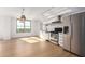 Modern kitchen with stainless steel appliances and white cabinetry at 535 W Thomas Rd # 508, Phoenix, AZ 85013