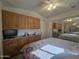 Bright bedroom with built-in cabinets and a comfortable bed at 650 N Hawes Rd # 5107, Mesa, AZ 85207